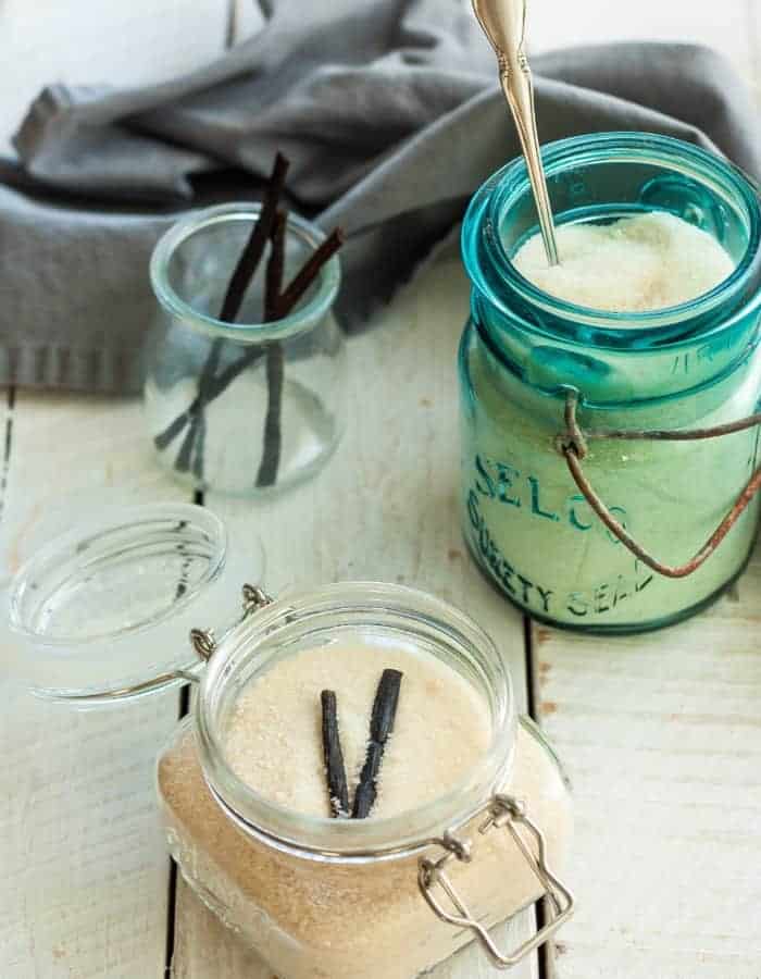 a blue mason jar filled with vanilla sugar