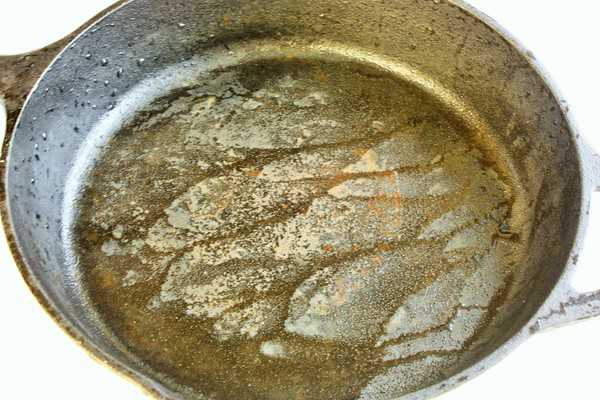 a wet cast iron skillet to show cast iron rust prevention