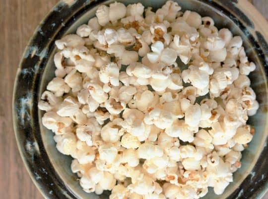 stove top popcorn in a blue bowl