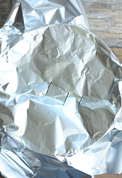 foil over a pot to make popcorn on the stovetop