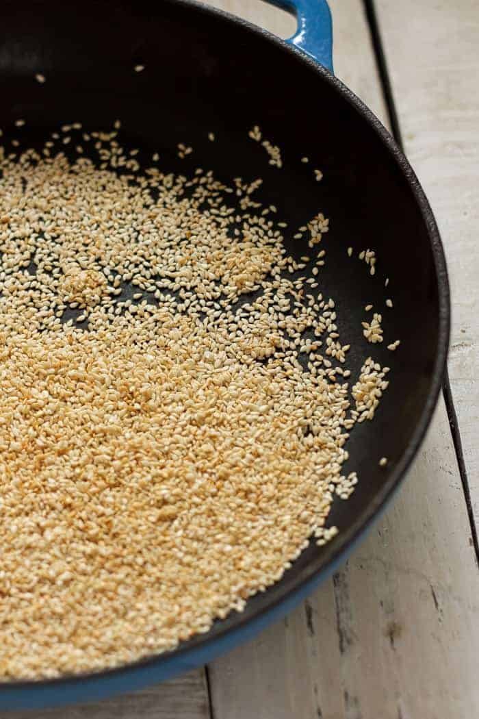 Sesame seeds in a cast iron skillet