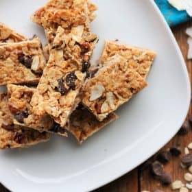 homemade granola bars on a plate with a chocolate chips | sustainablecooks.com