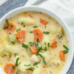 creamy gnocchi soup in a white bowl