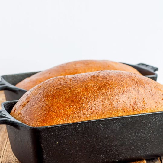 2 loaves of bread in cast iron bread pans