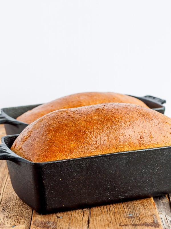 2 loaves of bread in cast iron bread pans