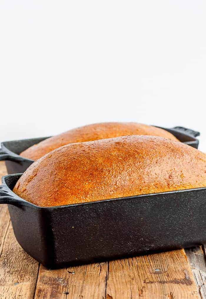 2 loaves of bread in cast iron bread pans