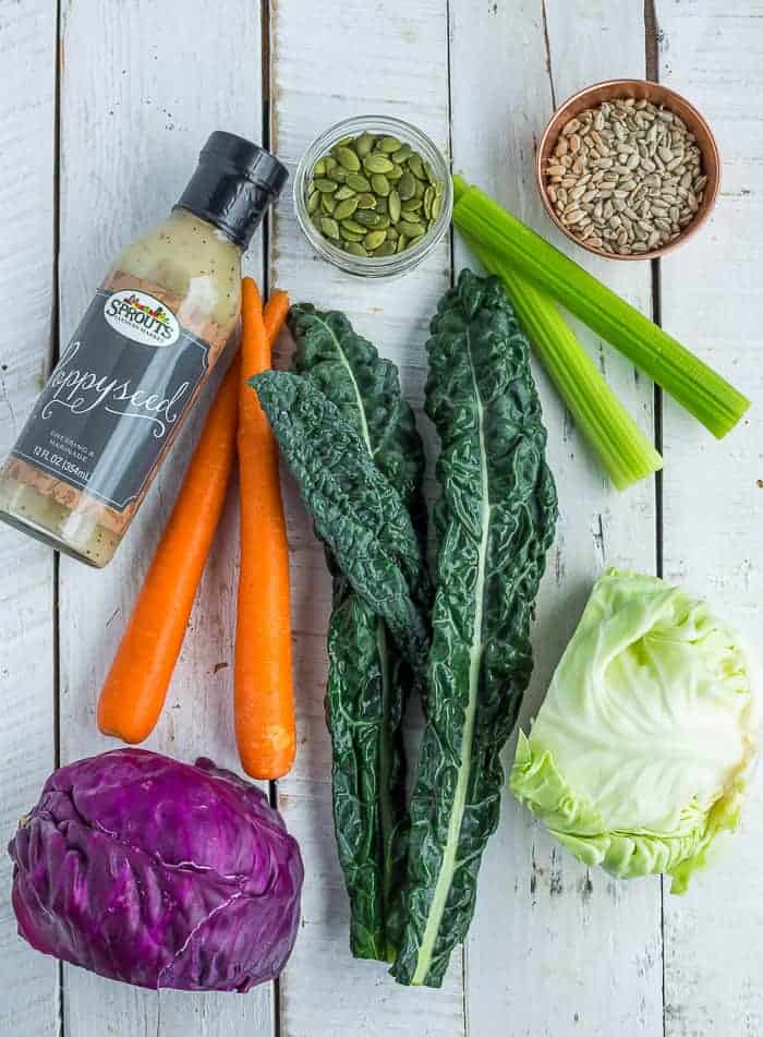 kale, cabbage, carrots, and other ingredients for making chopped salad