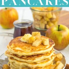 an overhead photo of apple pancakes on a plate with butter and diced apples