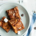 a plate of Nordy bars on a cloth with marshmallows and chocolate chips