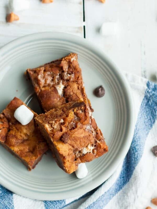 a plate of Nordy bars on a cloth with marshmallows and chocolate chips