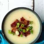 a bowl of whole30 potato soup with bacon and green onions