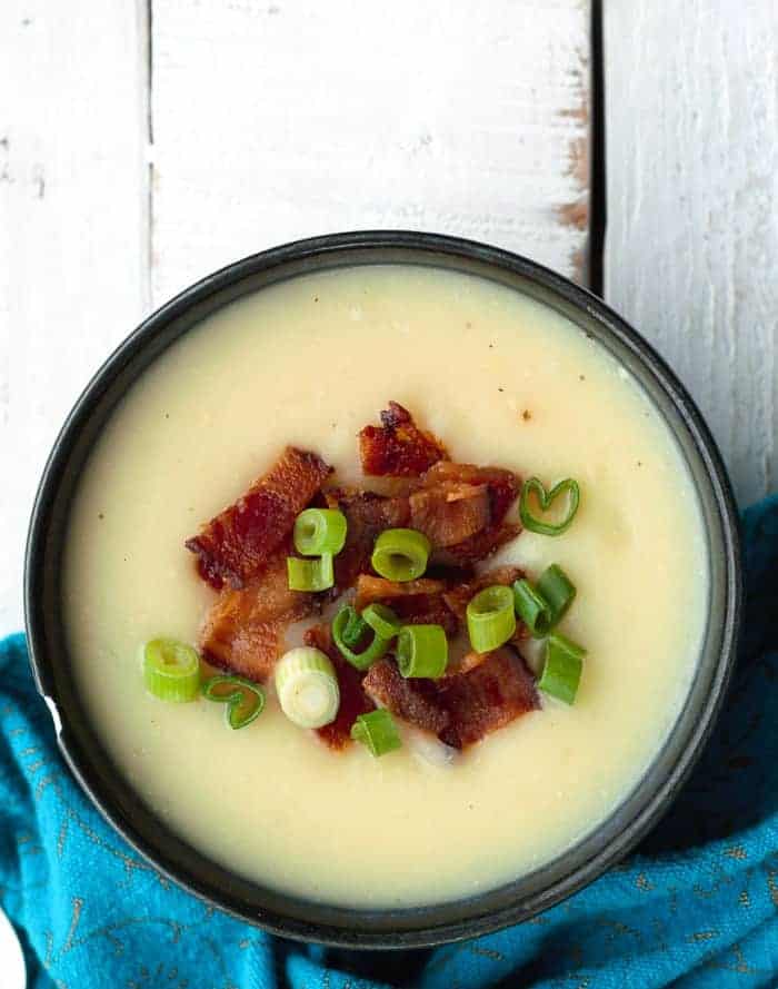 a bowl of whole30 potato soup with bacon and green onions