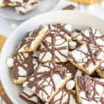 a plate of chocolate smores bark with mini marshmallows