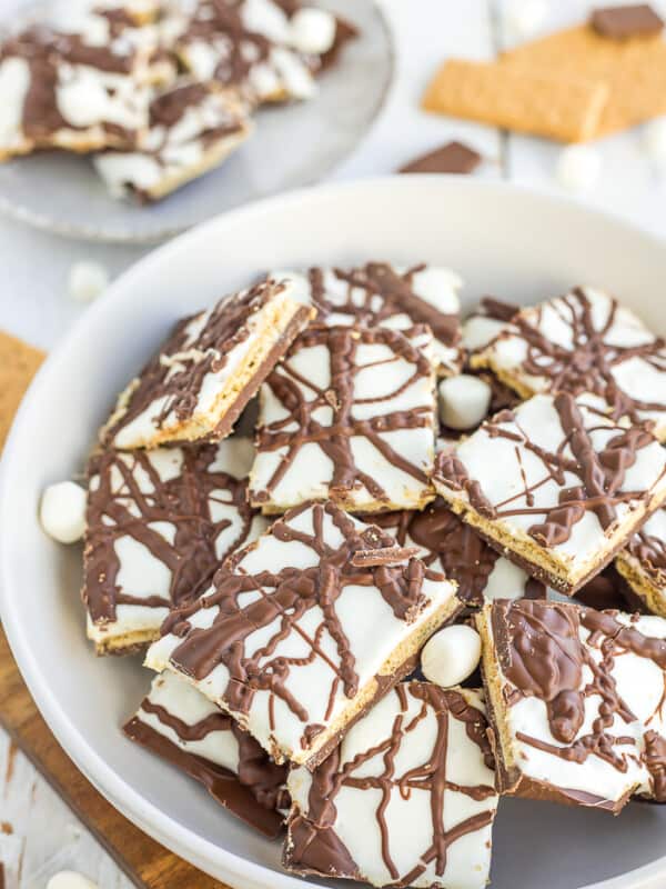 a plate of chocolate smores bark with mini marshmallows