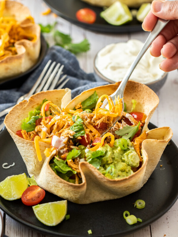a fork in a baked tortilla bowl