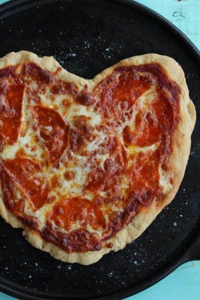 heart-shaped pizza on a cast iron tray | www.sustainablecooks.com