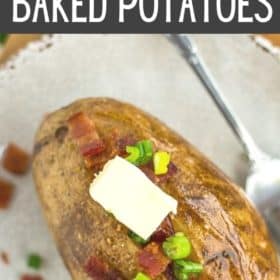 Crispy baked potatoes on a plate topped with butter and bacon