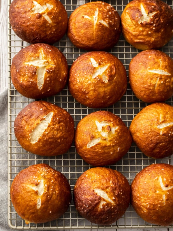 a cooling rack of homemade pretzel rolls