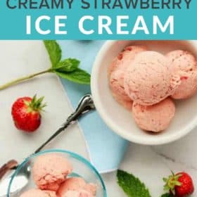 two bowls of strawberry ice cream with spoons and fresh strawberries
