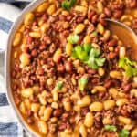 a bowl of instant pot cowboy beans topped with cilantro