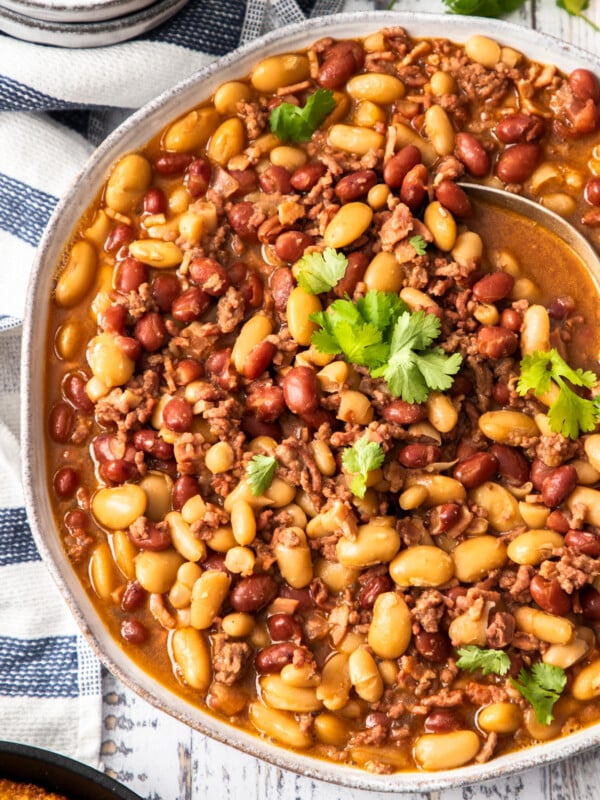 a bowl of instant pot cowboy beans topped with cilantro