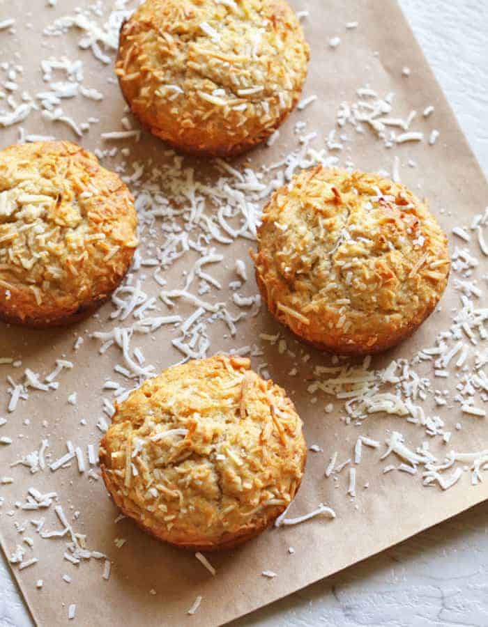 banana and coconut muffins on a baking sheet