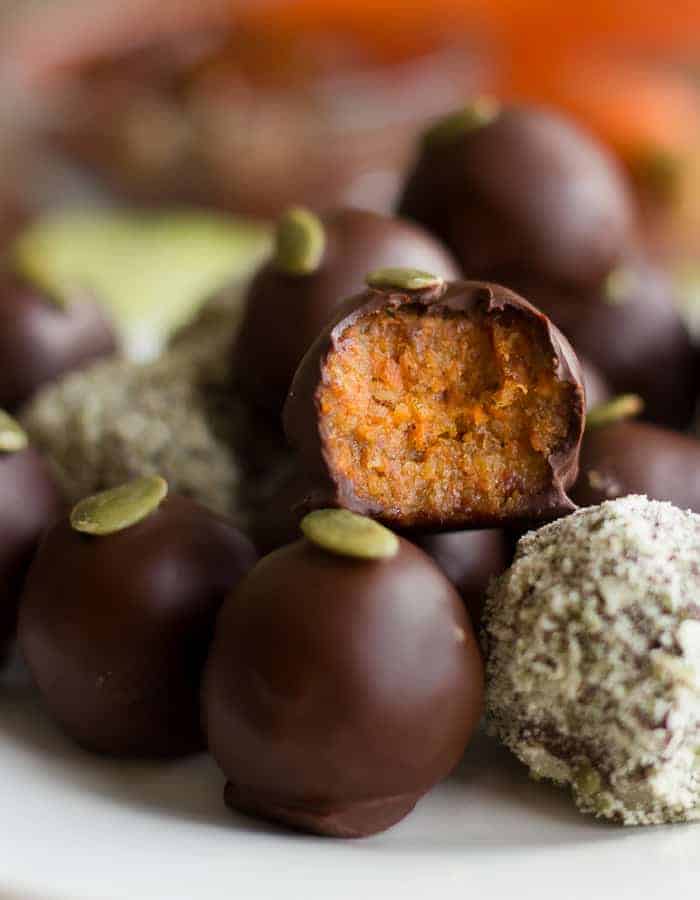 Chocolate carrot cake truffles stacked on a plate