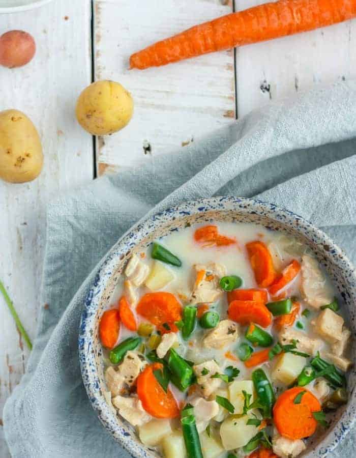 a bowl of paleo chicken pot pie soup