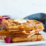 three eggnog waffles on a plate