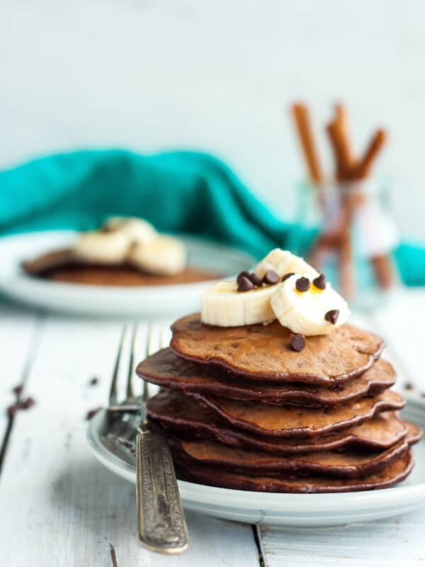 a stack of gluten-free chocolate chip banana pancakes on a plate