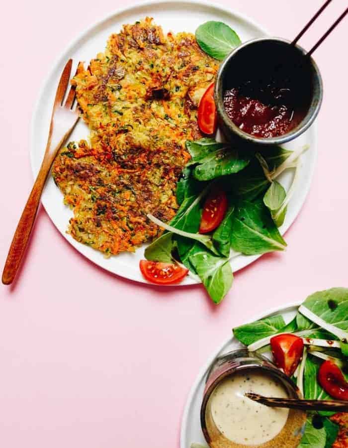 18 delicious and healthy Whole30 Breakfast Ideas to inspire your clean eating mornings. Family-friendly Whole30 breakfasts and brunch recipes that you'll love! #whole30 #whole30breakfast #paleobreakfast whole30 hashbrowns on a plate with sauce for whole30 breakfast ideas