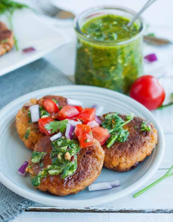 paleo salmon cakes with cilantro chimichurri on a plate for whole30 dinners