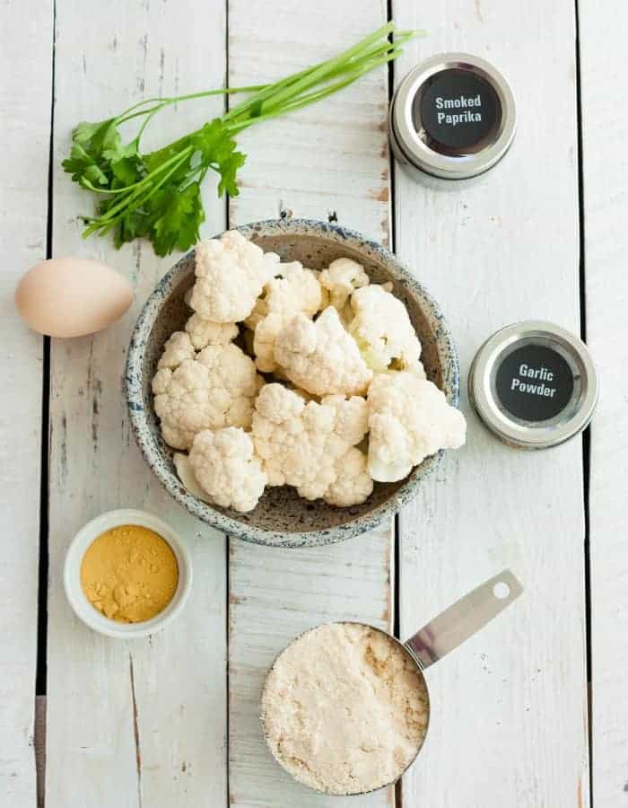 cauliflower, almond flour, an egg, and spices for making cauliflower fritters