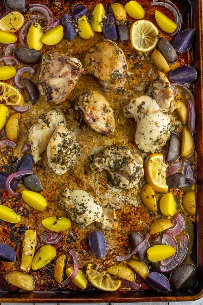 a sheet pan with greek chicken and potatoes