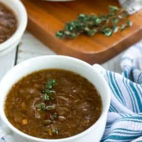 Two bowls of whole30 + paleo french onion soup with thyme