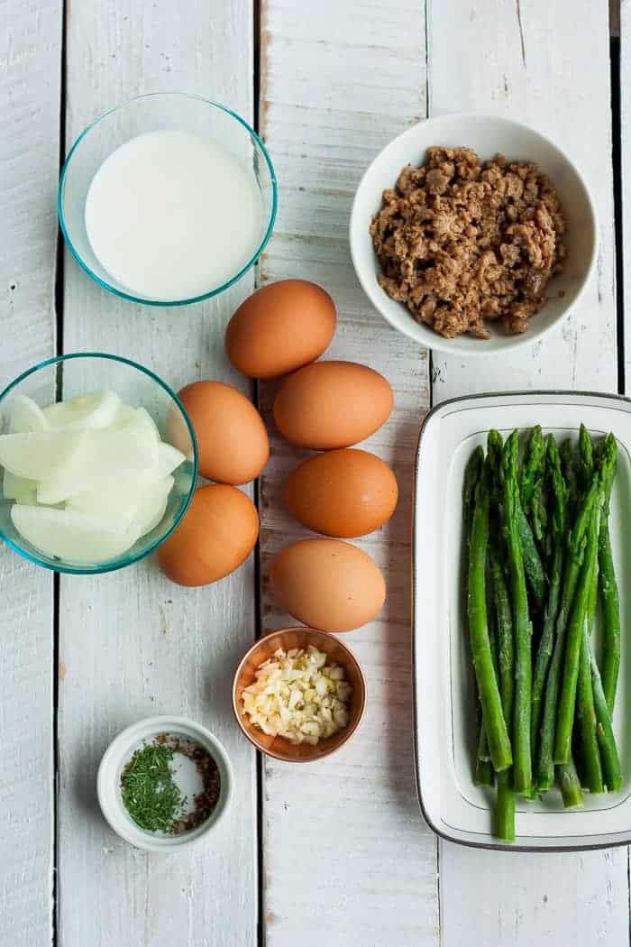 eggs, aspargus, sausage, and other ingredients for making a paleo frittata