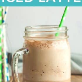 a blended iced latte in a mason jar glass with a straw