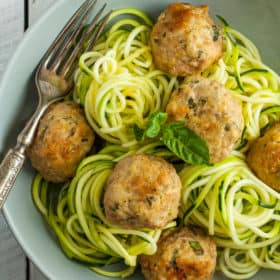 an overhead photo of glutenfree meatballs with zucchini noodles