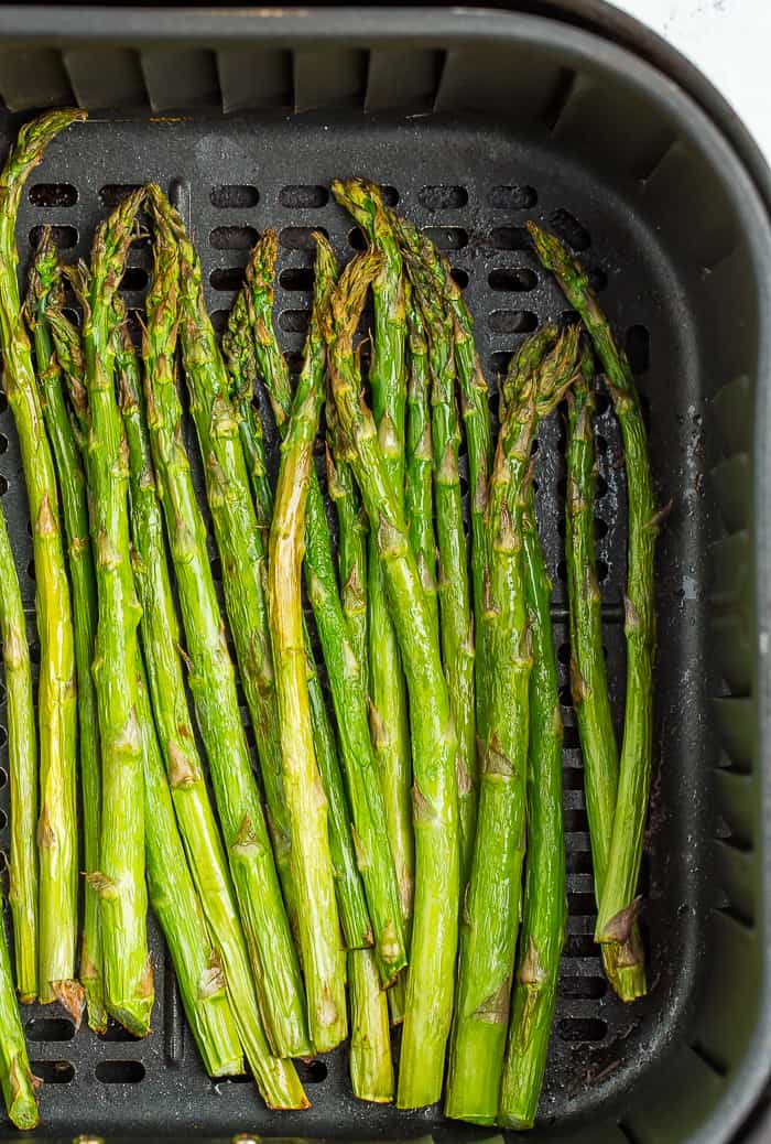 roasted asparagus in an cosori air fryer basket