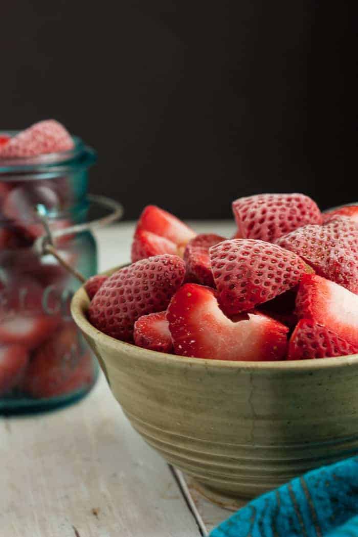 a bowl of frozen strawberries