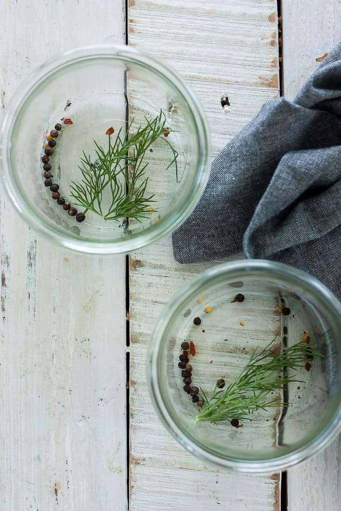 Peppercorns and dill in two jars
