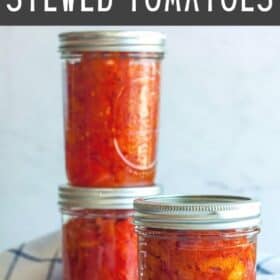 canning jars of stewed tomatoes