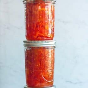 canning jars of stewed tomatoes