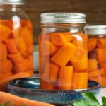 3 canning jars of canned carrots