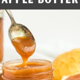 a spoonful of apple butter dripping off a spoon