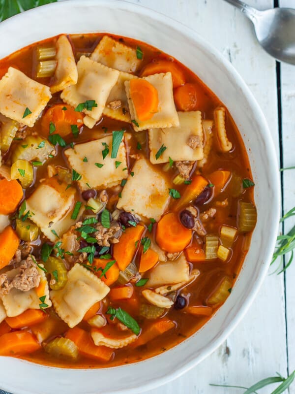 a bowl of Instant Pot Vegetable Noodle Soup topped with diced parsley