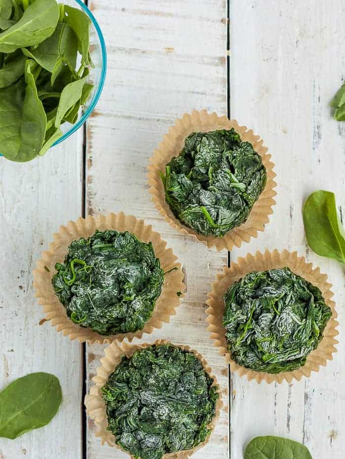 frozen chunks of spinach in muffin liners.