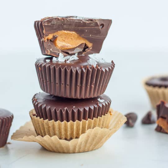 3 dark chocolate almond butter cups stacked on top of each other