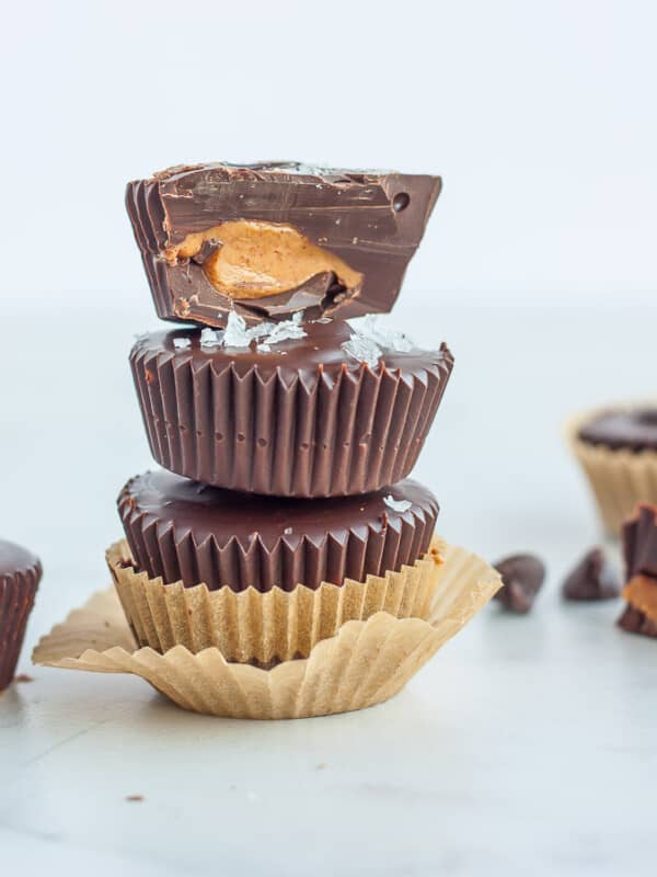 3 dark chocolate almond butter cups stacked on top of each other