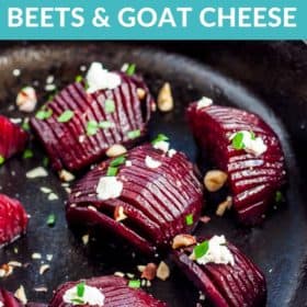 Hasselback roasted beets in a cast iron skillet topped with goat cheese